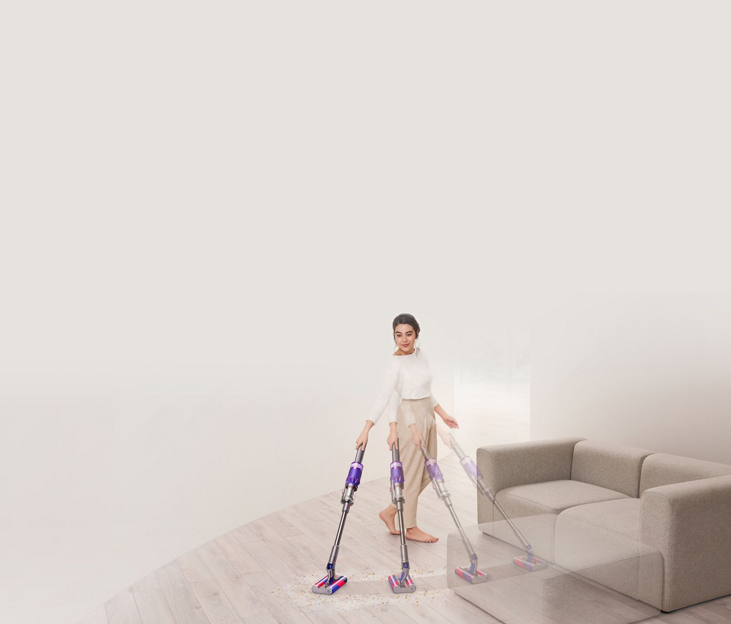 Dyson Omni-glide vacuum on hard floor around sofa
